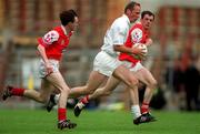 11 June 2000; Willie McCreery of Kildare in action against Simon Gerard, left, and Martin Farrelly of Louth during the Bank of Ireland Leinster Senior Football Championship Quarter-Final match between Kildare and Louth at Croke Park in Dublin. Photo by Brendan Moran/Sportsfile