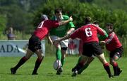 17 June 2000: Anthony Foley of Ireland is tackled by Scott Stewart, 10, and Gregor Dixon, 6, of Canada during the Rugby International match between Canada and Ireland at Fletcher's Fields in Markham, Ontario, Canada. Photo by Matt Browne/Sportsfile
