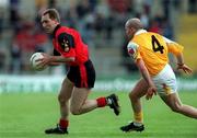 28 May 2000; Mickey Linden of Down in action against Anto Finnegan of Antrim during the Bank of Ireland Ulster Senior Football Championship Quarter-Final match between Antrim and Down at Casement Park in Belfast, Antrim. Photo by David Maher/Sportsfile