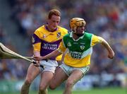 18 June 2000; Paudie Mulhare of Offaly in action against Rod Guiney of Wexford during the Guinness Leinster Senior Hurling Championship Semi-Final match between Offaly and Wexford at Croke Park in Dublin. Photo by Ray McManus/Sportsfile