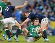 2 February 2014; Brian O'Driscoll, Ireland, is tackled by Duncan Weir, Scotland. RBS Six Nations Rugby Championship, Ireland v Scotland, Aviva Stadium, Lansdowne Road, Dublin. Picture credit: Brendan Moran / SPORTSFILE