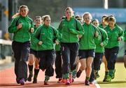 19 March 2015;  Ireland captain Megan Frazer leads her team-mates on a warm up lap of the pitch before the start of the game. World Hockey League 2, Quarter-Final, Ireland v Lithuania, National Hockey Stadium, UCD, Belfield, Dublin. Picture credit: Matt Browne / SPORTSFILE
