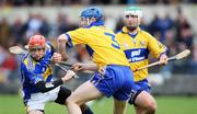 16 March 2008;  Pat Kerwick, Tipperary, in action against Frank Lohan and Tommy Holland, Clare. Allianz National Hurling League, Division 1B, Round 4, Clare v Tipperary, Cusack Park, Ennis, Co. Clare. Picture credit; Kieran Clancy / SPORTSFILE