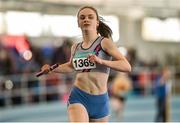21 March 2015; Rachel Dunne, Dundrum South Dublin AC, crosses the finish line to win the Women's U19 4x200m Relay Final event during Day one of the GloHealth Juvenile Indoor Track and Field Championships. Athlone International Arena, Athlone, Co.Westmeath.  Picture credit: Pat Murphy / SPORTSFILE