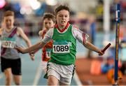 21 March 2015; Mark Carroll, Templemore AC, crosses the finish line to win the Men's U13 4x100m Relay Final event during Day one of the GloHealth Juvenile Indoor Track and Field Championships. Athlone International Arena, Athlone, Co.Westmeath.  Picture credit: Pat Murphy / SPORTSFILE