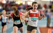 21 March 2015; Sinead Duggan, Galway City Harriers AC, crosses the finish line to win the Women's U13 4x100m Relay Final event during Day one of the GloHealth Juvenile Indoor Track and Field Championships. Athlone International Arena, Athlone, Co.Westmeath.  Picture credit: Pat Murphy / SPORTSFILE