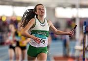 21 March 2015; Ciara Neville, Emerald AC, crosses the finish line to win the Women's U17 4x200m Relay Final event during Day one of the GloHealth Juvenile Indoor Track and Field Championships. Athlone International Arena, Athlone, Co.Westmeath.  Picture credit: Pat Murphy / SPORTSFILE