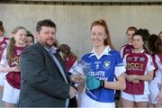 21 March 2015; Aisling Moloney, Coláiste Dún Iascaigh, is presented with her player of the match award by Ian O'Brien. TESCO All Ireland PPS Senior A Final, Coláiste Dún Iascaigh, Tipperary v Glenamaddy Community School, Galway. Kinnitty, Co. Offaly. Picture credit: Matt Browne / SPORTSFILE