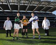 17 March 2008; Nemo Rangers captain Niall Geary, left, and St Vincents captain Tomas Quinn shake hands in front of referee Joe McQuillan. AIB All-Ireland Club Football Final, St Vincents v Nemo Rangers, Croke Park, Dublin. Picture credit; Ray McManus / SPORTSFILE
