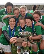 22 March 2015; Tania Rosser and her Ireland team-mates celebrate with the Women's Six Nations Rugby Championship trophy. Women's Six Nations Rugby Championship, Scotland v Ireland. Broadwood Stadium, Clyde FC, Glasgow, Scotland. Picture credit: Stephen McCarthy / SPORTSFILE