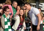22 March 2015; Eimear McEnroe, from Ballyjamesduff, Co. Cavan, takes a photo with Jonathan Sexton after the Ireland team's arrival at Dublin Airport after beating Scotland to win the RBS Six Nations Championship. Dublin Airport, Dublin. Picture credit: Brendan Moran / SPORTSFILE