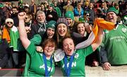 22 March 2015; Ireland players Ruth O'Reilly, left, and Ailis Egan celebrate with supporters after winning the Women's Six Nations Rugby Championship. Women's Six Nations Rugby Championship, Scotland v Ireland. Broadwood Stadium, Clyde FC, Glasgow, Scotland. Picture credit: Stephen McCarthy / SPORTSFILE