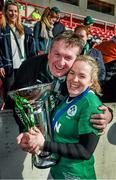 22 March 2015; Ireland captain Niamh Briggs celebrates with her father Mike after her side won the Women's Six Nations Rugby Championship. Women's Six Nations Rugby Championship, Scotland v Ireland. Broadwood Stadium, Clyde FC, Glasgow, Scotland. Picture credit: Stephen McCarthy / SPORTSFILE