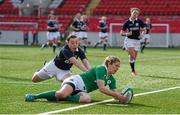 22 March 2015; Alison Miller, Ireland, goes over to score a late try despite the tackle of Eilidh Sinclair, Scotland. Women's Six Nations Rugby Championship, Scotland v Ireland. Broadwood Stadium, Clyde FC, Glasgow, Scotland. Picture credit: Stephen McCarthy / SPORTSFILE