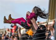 22 March 2015; Clare supporter Noel Marshall, from Shannon, flings his daughter Nicole, five years, in the air as they celebrate their side's second goal. Allianz Hurling League Division 1A, round 5, Kilkenny v Clare, Nowlan Park, Kilkenny. Picture credit: Ray McManus / SPORTSFILE