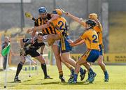 22 March 2015; Linesman David Hughes keeps a close eye as Kilkenny's William Phelan kicks the sliothar up-field under pressure from Clare players Seadna Morey, David Reidy and Colm Galvin. Allianz Hurling League Division 1A, round 5, Kilkenny v Clare, Nowlan Park, Kilkenny. Picture credit: Ray McManus / SPORTSFILE