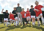 26 March 2008: A coaching team of experts were on hand to share their knowledge with children from Dublin's Docklands. This three day event has been developed for young people between the ages of 8 to 13 years who want to develop their football skills. Niall Quinn puts some children from the Docklands area through their paces. Tolka Rovers Sports Complex, Griffith Avenue Extension, Dublin. Picture credit; Brian Lawless / SPORTSFILE