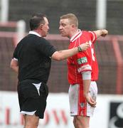 29 March 2008; David McAlinden, Cliftonville, disputes a decision with referee  Adrian McCourt. JJB Sports Irish Cup semi-final, Cliftonville v Linfield, The Oval, Belfast. Picture credit: Oliver McVeigh / SPORTSFILE