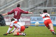 30 March 2008; Padraic Joyce, Galway, beats Michael McBride Derry to score his side's second goal Allianz National Football League, Division 1, Round 5, Galway v Derry, Pearse Stadium. Galway. Picture David Maher / SPORTSFILE