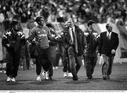 16 October 1991; Republic of Ireland's Mick McCarthy speaks to manager Jack Charlton as they leave the pitch after the game. UEFA Euro 1992 qualifying Group 7 match, Poland v Republic of Ireland, Stadion Miejski, Poznan, Poland. Picture credit: Ray McManus / SPORTSFILE