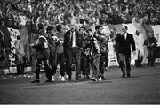 16 October 1991; Republic of Ireland manager Jack Charlton leaves the pitch after the game surrounded by substitutes and backroom staff. UEFA Euro 1992 qualifying Group 7 match, Poland v Republic of Ireland, Stadion Miejski, Poznan, Poland. Picture credit: Ray McManus / SPORTSFILE