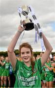 26 March 2015; Scoil Críost Rí captain Orla Carroll lifts the cup after the game. TESCO All Ireland PPS Junior C Final, Scoil Mhuire & Padraig, Swinford v Scoil Críost Rí, Portlaoise. Tubberclair, Co. Westmeath. Picture credit: Piaras O Midheach / SPORTSFILE