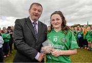 26 March 2015;  Con Moynihan, Development Officer with Ladies Football, presents player of the match Erone Fitzpatrick, Scoil Críost Rí, with her award. TESCO All Ireland PPS Junior C Final, Scoil Mhuire & Padraig, Swinford v Scoil Críost Rí, Portlaoise. Tubberclair, Co. Westmeath. Picture credit: Piaras O Midheach / SPORTSFILE