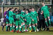 26 March 2015; The Republic of Ireland players celebrate at the end of the game, after qualifying for the UEFA U17 Championships. UEFA U17 Championships Elite Phase, Group 4, Republic of Ireland v Poland. Stadium Groclin Dyskobolia, Grodzisk Wielkopolski, Poland. Picture credit: Jakub Piasecki / SPORTSFILE