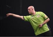 26 March 2015; Michael van Gerwen competes against Raymond van Barneveld during the Betway Premier League Darts at the 3Arena, Dublin. Picture credit: Stephen McCarthy / SPORTSFILE
