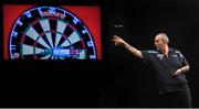 26 March 2015; Phil Taylor competes against Kim Huybrechts during the Betway Premier League Darts at the 3Arena, Dublin. Picture credit: Stephen McCarthy / SPORTSFILE