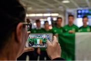 27 March 2015; Family and friends of Republic of Ireland players take pictures following the team's arrival at Dublin Airport after qualifying for the UEFA U17 Championships. Dublin Airport, Dublin. Picture credit: Piaras O Midheach / SPORTSFILE