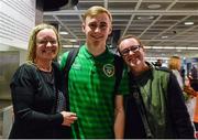 27 March 2015; Republic of Ireland's Luke Wade-Slater, with Siobhan Slater, left, and Sinead Slater, all from Dunshaughlin, Co Meath, pictured on the team's arrival at Dublin Airport after qualifying for the UEFA U17 Championships. Dublin Airport, Dublin. Picture credit: Piaras O Midheach / SPORTSFILE