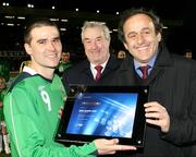 26 March 2008; UEFA President Michel Platini presents Northern Ireland's David Healy with a special award in recognition of his 13 goals he scored in the Euro 2008 qualifying campaign. Also pictured is Irish FA President Raymond Kennedy, centre. International Friendly, Northern Ireland v Georgia, Windsor Park, Belfast, Co. Antrim. Picture credit; SPORTSFILE - Pool picture by William Cherry *** Local Caption ***