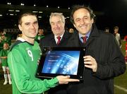 26 March 2008; UEFA President Michel Platini presents Northern Ireland's David Healy with a special award in recognition of his 13 goals he scored in the Euro 2008 qualifying campaign. Also pictured is Irish FA President Raymond Kennedy, centre. International Friendly, Northern Ireland v Georgia, Windsor Park, Belfast, Co. Antrim. Picture credit; SPORTSFILE - Pool picture by William Cherry