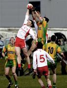 30 March 2008; Enda McGinley, Tyrone, in action against Rory Kavanagh, Donegal. Allianz National Football League, Division 1, Round 5, Tyrone v Donegal, Edendork, Co Tyrone. Picture credit; Michael Cullen / SPORTSFILE