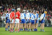 30 March 2008; Tim Kenny, 11, and Fintan O'Leary Cork, stand for the National Anthem with the Waterford players. Allianz National Hurling League, Division 1A, Play Off, Waterford v Cork, Walsh Park, Waterford. Picture credit: Matt Browne / SPORTSFILE