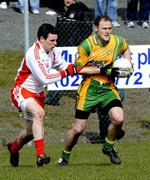 30 March 2008; Colm McFadden, Donegal, in action against Conor Gormley, Tyrone. Allianz National Football League, Round 5, Tyrone v Donegal, Edendork, Co Tyrone. Picture credit; Michael Cullen / SPORTSFILE