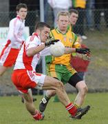 30 March 2008; Philip Jordan, Tyrone, in action against Brian Roper, Donegal. Allianz National Football League, Division 1, Round 5, Tyrone v Donegal, Edendork, Co Tyrone. Picture credit; Michael Cullen / SPORTSFILE