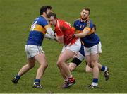 15 March 2015; Bevan Duffy, Louth, in action against Tipperary players Barry Grogan, left, and Ger Mulhare. Allianz Football League, Division 3, Round 5, Louth v Tipperary, Gaelic Grounds, Drogheda, Co. Louth. Picture credit: Brendan Moran / SPORTSFILE