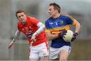 15 March 2015; Peter Acheson, Tipperary, in action against Ryan Burns, Louth. Allianz Football League, Division 3, Round 5, Louth v Tipperary, Gaelic Grounds, Drogheda, Co. Louth. Picture credit: Brendan Moran / SPORTSFILE