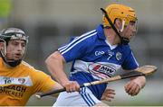 28 March 2015; Conor Dunne, Laois, in action against Conor Johnston, Antrim. Allianz Hurling League, Division 1B, Relegation Play-off, Laois v Antrim. O'Moore Park, Portlaoise, Co. Laois. Picture credit: Piaras Ó Mídheach / SPORTSFILE