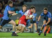 28 March 2015; Benny Heron, Derry, in action against Jack McCaffrey, John Small and Jonny Cooper, Dublin. Allianz Football League, Division 1, Round 6, Dublin v Derry. Croke Park, Dublin. Picture credit: Ray McManus / SPORTSFILE