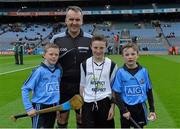 28 March 2015; Match referee Diarmuid Kirwan with young referee Mark Connellan, St Patrick's NS, Diswellstown, and mascots Conor Newton, left, aged 9, and his St Fiachra's NS colleague Cillian Keegan, aged 9, before the game. Allianz Hurling League, Division 1, Quarter-Final, Dublin v Limerick. Croke Park, Dublin. Picture credit: Ray McManus / SPORTSFILE