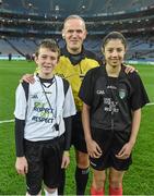 28 March 2015; Match referee Conor Lane with young referees Fionn Halligan, St Pius NS, Tempelogue, and Jasmin Kamtoh, Holy Trinity, NS, before the game. Allianz Football League, Division 1, Round 6, Dublin v Derry. Croke Park, Dublin. Picture credit: Ray McManus / SPORTSFILE
