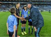 28 March 2015; Dublin managerJim Gavin introduces himself to with young referee Jasmin Kamtoh, Holy Trinity, NS, as mascots Daniel Sheridan, Scoil Mhuire, Howth, Jasmin Kamtoh, Holy Trinity, N.S., Clodagh McCahey, Gael Scoil Chnoc Lamhna, Knocklyon, and Sean McCabe, Gael Scoil Míde, Kilbarrack, look on before the game. Allianz Football League, Division 1, Round 6, Dublin v Derry. Croke Park, Dublin. Picture credit: Ray McManus / SPORTSFILE