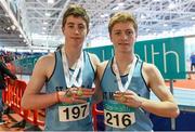 28 March 2015; Brothers Daragh Miniter, left, and Joseph Miniter, St. Mary's AC, Co. Clare, during day three of the GloHealth Juvenile Indoor Track and Field Championships. Athlone International Arena, Athlone, Co.Westmeath. Picture credit: Ramsey Cardy / SPORTSFILE