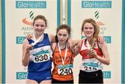 28 March 2015; On the podium after the Girls's Under 14 Long Jump event are, from left, second placed, Lauren Callaghan, Finn Valley A.C, first placed Niamh Foley, St. Mary's A.C, Limerick, and third placed Zoe Moore, Galway City Harriers A.C, during day three of the GloHealth Juvenile Indoor Track and Field Championships. Athlone International Arena, Athlone, Co.Westmeath. Picture credit: Ramsey Cardy / SPORTSFILE
