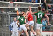 29 March 2015; Brian Hyrley, Cork, fists the ball past Mayo goalkeeper David Clarke and defender Lee Keegan to score his side's winning goal. Allianz Football League, Division 1, Round 6, Cork v Mayo. Páirc Uí Rinn, Cork. Picture credit: Matt Browne / SPORTSFILE