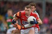 29 March 2015; Brian Hurley, Cork, in action against David Clarke, Mayo. Allianz Football League, Division 1, Round 6, Cork v Mayo. Páirc Uí Rinn, Cork. Picture credit: Matt Browne / SPORTSFILE