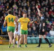 29 March 2015; Donegal's Michael Murphy, left, receives a second half black card from referee Joe McQuillan after a challenge on Tyrone's Sean Cavanagh. Allianz Football League, Division 1, Round 6, Donegal v Tyrone. MacCumhail Park, Ballybofey, Co. Donegal. Picture credit: Oliver McVeigh / SPORTSFILE